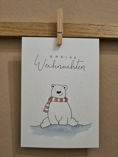 a drawing of a polar bear with a scarf around its neck