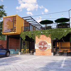 the outside of a restaurant with tables and umbrellas over it's roof area