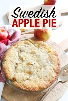 an apple pie on a cutting board with the words swedish apple pie in front of it