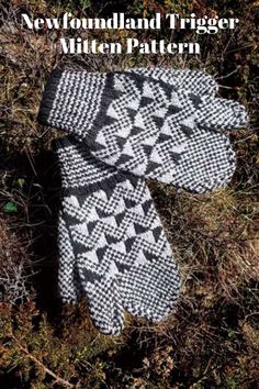 a knitted mitt laying on top of grass