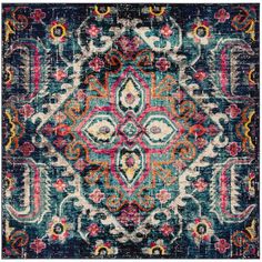 an ornate blue and pink rug with lots of colorful details on the front, in different colors