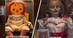 there are two creepy dolls on display in the store front and behind them is an old doll with red hair