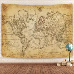 an old world map hanging on the wall in a room with books and a lamp