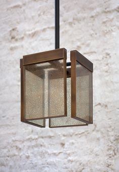 a square light fixture hanging from a ceiling