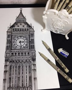 an image of the big ben clock tower with markers and pencils on it's side