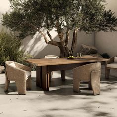 an outdoor dining table with chairs around it and a tree in the corner behind it