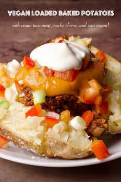 a loaded baked potato on a white plate