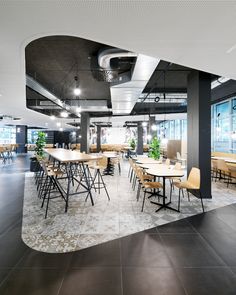 an empty conference room with tables and chairs