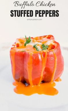 stuffed peppers with cheese and sauce on a white plate in front of the words buffalo chicken stuffed peppers