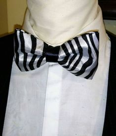 "Stunning and classic bow tie has been design in exotic, bright satin prints. The Unisex bow ties are an excellent evening addition to any wardrobe. You will look unique at any special occasion. Our bow ties are made in fine satin with interfacing to give it, stability and shape. Approximate Measurements: Bow: 5\" x 2.5\" Adjustable Strap: 14\" x 19\" Bow Tie care recommended Dry Clean only. All items are sent Via USPS First Class Mail within the U.S. shipping times take an average of 5-7 Busine Wedding Tuxedo, Minnie Bow, Custom Bows, Tuxedo Wedding, Minnie Mouse Birthday, Mens Bow Ties, Minnie Ears, Ear Headbands, Tie Accessories