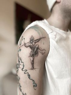 a man with a tattoo on his arm