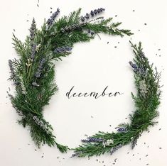 the word december is surrounded by lavenders and rosemary