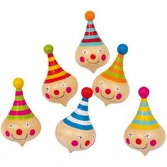 wooden toy clowns with colorful hats on white background