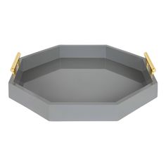 a gray tray with gold handles on the top and bottom, sitting in front of a white background