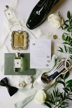 an assortment of wedding items including shoes, perfumes and flowers