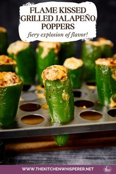 some green peppers are on a tray with the words flame kissed grilled jalapeno poppers