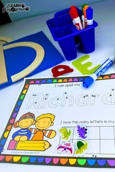 a table topped with lots of different types of writing and crafting supplies on top of it