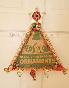 a glass christmas tree ornament hanging from the side of a door with an american made sign on it