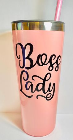 a pink glass with the words boss lady on it and a straw sticking out of it