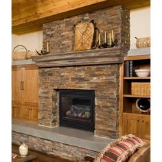 a living room with a stone fireplace and wooden shelves filled with baskets on top of it