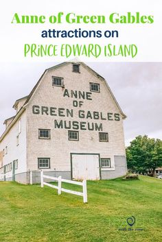 an old white barn with the words anne of green gabless on it's side