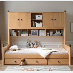 a child's bedroom with a bed, bookcase and toys on the floor