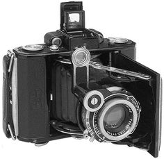 an old fashioned camera is shown in black and white