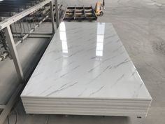 several stacks of white marble in a factory