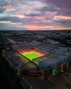 an aerial view of a soccer stadium at sunset