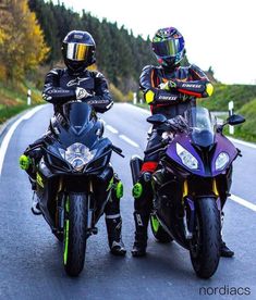 two motorcyclists are riding down the road on their bikes and one is wearing a helmet