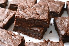 chocolate brownies cut into squares on a white surface