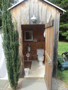 an outhouse with the words choose wood for your door