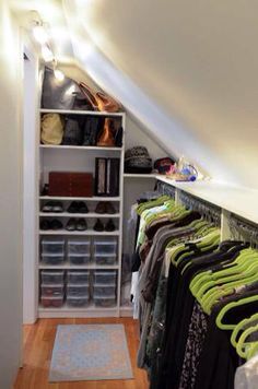 an image of a closet with clothes on it