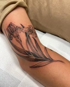 a woman's arm with flowers on it