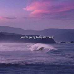 an ocean with waves and mountains in the background that says, you're going to figure it out