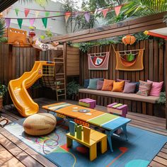 an outdoor play area with colorful furniture and decorations on the walls, along with a yellow slide