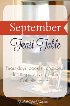 a wooden table with a red and white sign that says, september feast table