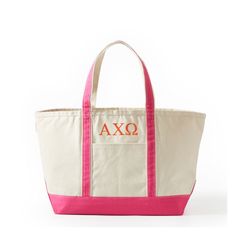 a pink and white tote bag with the word axq on it's side