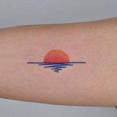 the sun is setting over the water on this arm