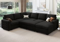 a living room with a large black sectional couch