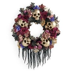 a wreath with skulls and flowers on it