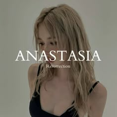 a woman with long blonde hair is wearing a black top and has the words anastasia on it