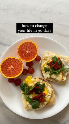 two pieces of bread on a plate with grapefruit and oranges next to it