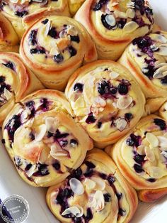 there are many blueberry rolls in the dish