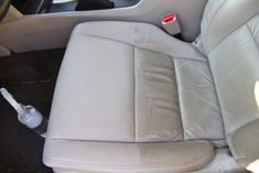 the interior of a car with leather seats