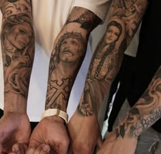 several people holding hands with tattoos on their arms and arm sleeves, all in different designs