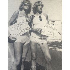 two women in bathing suits holding signs that say donde du quieress and giannie