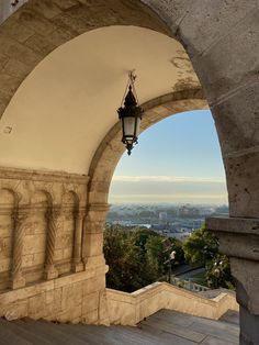 an arch with a light hanging from it's side