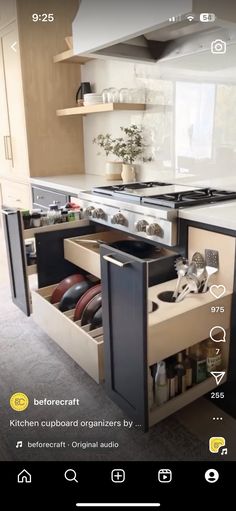 an open drawer in the middle of a kitchen