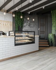 a bakery with white brick walls and wooden floors